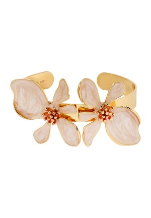 Gold cuff bracelet with two large cream-colored flower designs, each having textured petals and cluster-style centers.