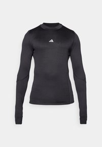 Langarm-Sportshirt in Schwarz, mit slim Fit, Rundhalsausschnitt und einem weißen Adidas-Logo auf der Brust. Glattes, dehnbares Material.