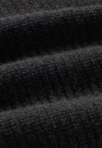 Black wool fabric with a textured, ribbed pattern, featuring soft, fuzzy fibers and a smooth overall appearance.