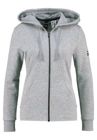 Grijze zip-up hoodie gemaakt van zachte stof, met een ruime capuchon, voorzakken en geribbelde manchetten, met een logo-accent op de mouw.
