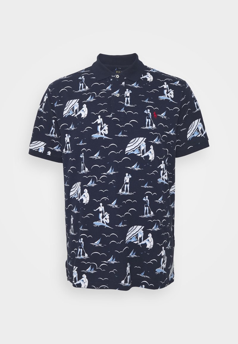 Navy polo shirt with white and light blue beach-themed print, featuring figures, clouds, and sailboats. Includes a small red logo on the chest.