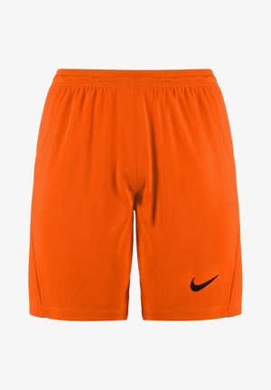Shorts de sport orange vif avec taille élastique et logo Nike swoosh noir sur la partie inférieure droite de la jambe.