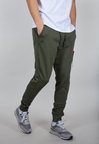 Alpha Industries Donji dijelovi trenirke - dark green