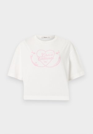 White cropped T-shirt with pink heart and chili pepper graphic and "Chica Caliente" text centered on chest.