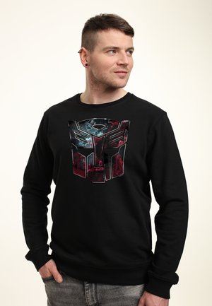 Henry Tiger TRANSFORMERS AUTOBOT FACE BADGE - Bluza