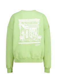 Light green sweatshirt with a graphic of a flower shop on the back, featuring white outlines, text, and a bicycle design. Soft material, relaxed fit.