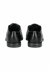 Zapatos de vestir de cuero negro con un acabado suave, puntera redonda y suela de goma texturizada con mínimos detalles de costura.