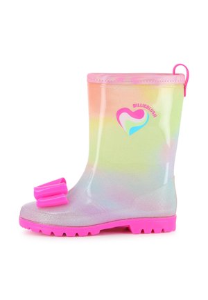 Botte de pluie scintillante enfant arc-en-ciel avec semelle rose, nœud rose sur le bout du pied et logo en forme de cœur sur le côté.