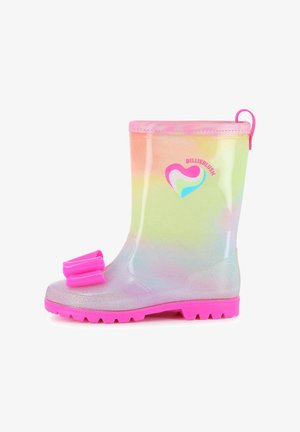 Botte de pluie scintillante enfant arc-en-ciel avec semelle rose, nœud rose sur le bout du pied et logo en forme de cœur sur le côté.