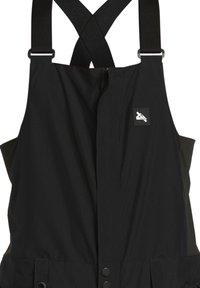 Black bib overalls with adjustable cross-back straps, front zipper and snap closures, featuring a small branding patch on the chest.