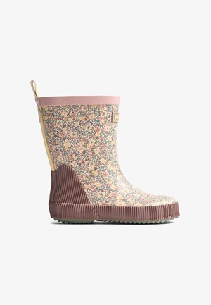 Botte de pluie pour enfant à la cheville avec bordure rose, semelle brun côtelée et motif floral aux couleurs pastel.