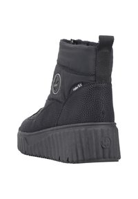 Bottines noires à chevilles avec un dessus texturé, rembourrées pour la chaleur, dotées d'une semelle en caoutchouc épaisse et nervurée et d'une languette pour un enfilage facile.