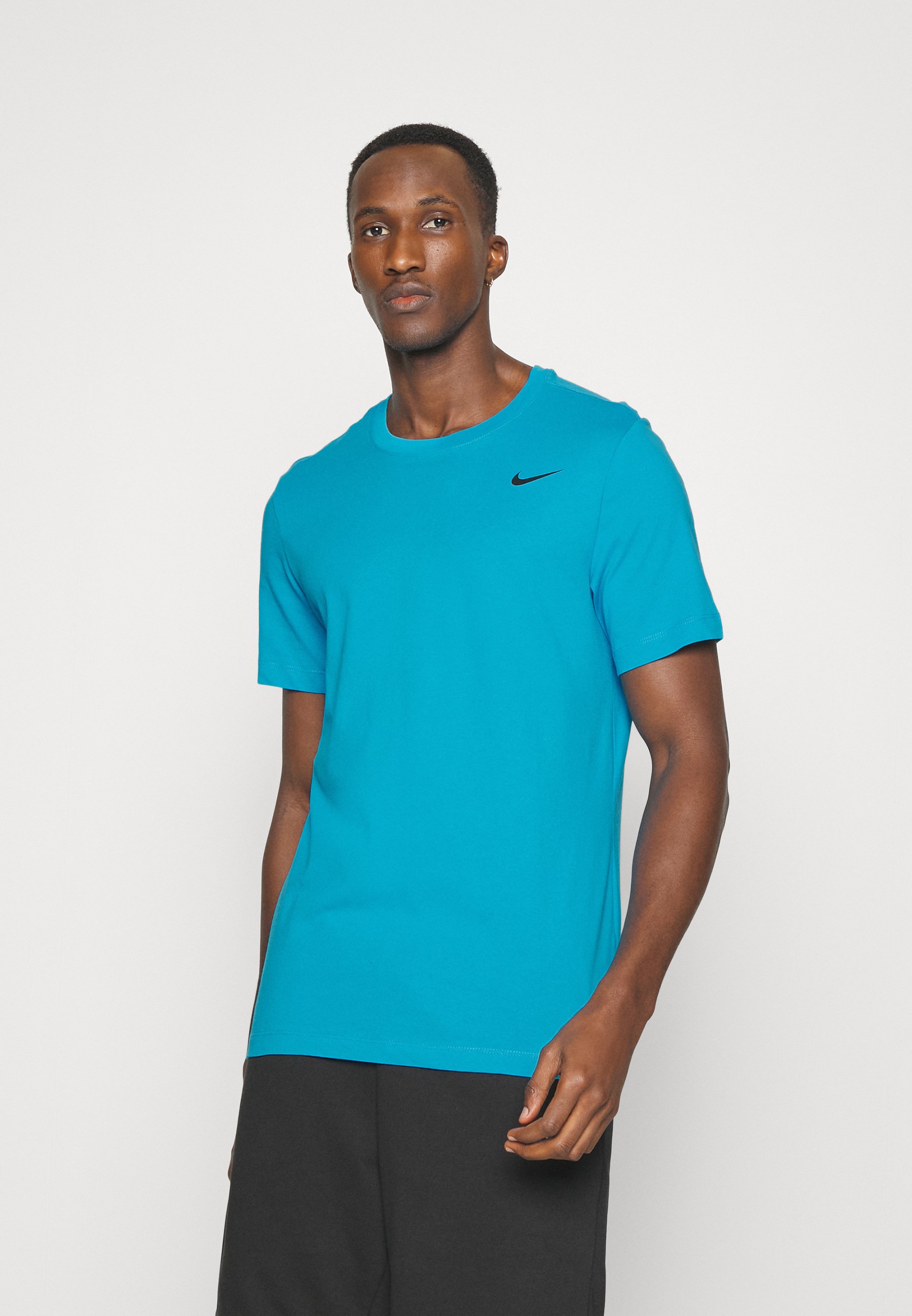 teal color nike shirt