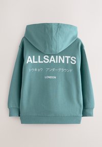 Türkiz színű kapucnis pulóver pamutból, nagy fehér "ALLSAINTS" felirattal és japán karakterekkel a hátoldalon, bordázott mandzsettával és szegéllyel.