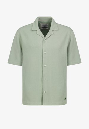 Light green short-sleeve button-up shirt with a camp collar and subtle ribbed texture, size medium, branded "Sublevel" on the collar and hem.