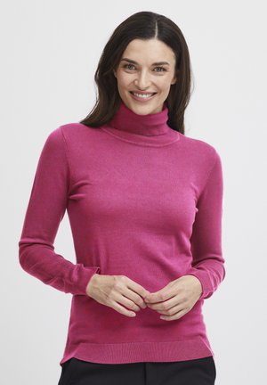Pull à col roulé ajusté en rose vif, fabriqué en tissu tricoté doux avec des poignets et un ourlet côtelés, présentant une texture subtile.