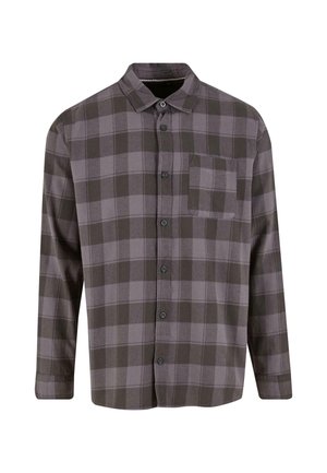 Garais, ar pogām aizpogājams krekls tumši pelēkā un gaiši pelēkā kvadrātā. Izgatavots no mīksta auduma, ar vienu krūšu kabatu un klasisku apkakli.