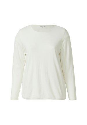 Chemise à manches longues et col rond en tissu doux de couleur blanc cassé. Présente une texture lisse et un design simple, sans motifs ni accents supplémentaires.