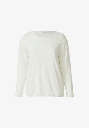 Chemise à manches longues et col rond en tissu doux de couleur blanc cassé. Présente une texture lisse et un design simple, sans motifs ni accents supplémentaires.