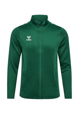 Groene sportjack met hoge kraag, volledige rits en witte schouderstrepen. Gemaakt van soepel, lichtgewicht materiaal met een logo op de borst.