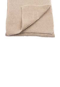 Coperta beige lavorata a maglia con una texture a coste, caratterizzata da un angolo piegato. Materiale morbido con un aspetto accogliente e un motivo uniforme.