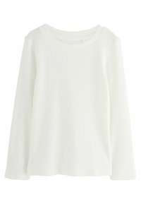 T-shirt à manches longues côtelé en blanc avec un col rond. Présente un tissu texturé et une coupe décontractée. Pas de fermetures ni de motifs visibles.
