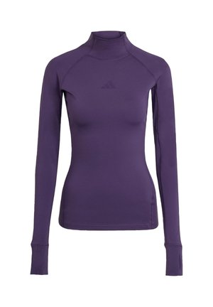 T-shirt de sport à manches longues violet avec un col haut, un design sans coutures et un logo discret à l'avant. Fabriqué à partir d'un tissu lisse et extensible.