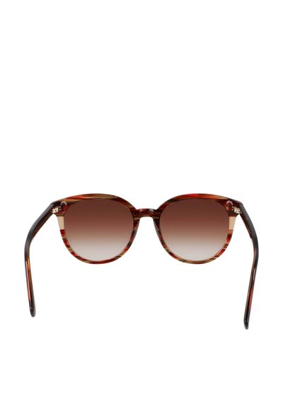 Round sunglasses with a tortoiseshell frame, gradient brown lenses, and sleek black temple arms. Features subtle metallic accents near the hinges.