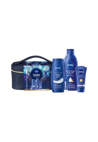 NIVEA skincare gift set with a navy zippered bag. Contains white and blue bottles: body milk, cream, and lip balm, featuring smooth textures.