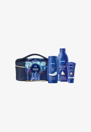 NIVEA skincare gift set with a navy zippered bag. Contains white and blue bottles: body milk, cream, and lip balm, featuring smooth textures.