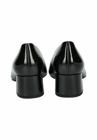 Black patent leather shoes with a rounded toe and block heel. Smooth texture with visible stitching along the back seam.