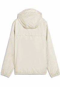 Ljusbeige lättviktsjacka med huva, elastiska ärmslut och en slät, vattenavvisande yta. Enfärgad baksida utan synliga logotyper eller mönster.