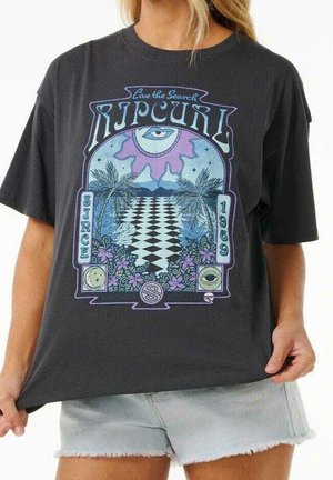 T-shirt noir avec un graphisme coloré d'un chemin en damier, des palmiers, des fleurs et des yeux, texte "Rip Curl Since 1969" et "Live the Search."