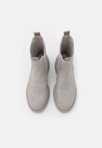 Gray suede ankle boots with a rounded toe, elastic side panels, and a textured rubber sole, featuring a minimalist design and pull tab.