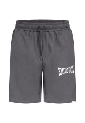Grå atletiske shorts med et struktureret stof, elastisk talje, snøre og et hvidt logo "SMILODOX" på siden.