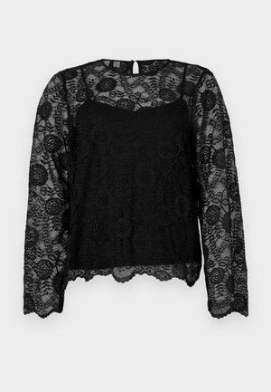 Top de encaje negro con mangas largas, cuello redondo, patrones florales, dobladillo festoneado y una pequeña abertura en forma de ojo de cerradura en la parte trasera.