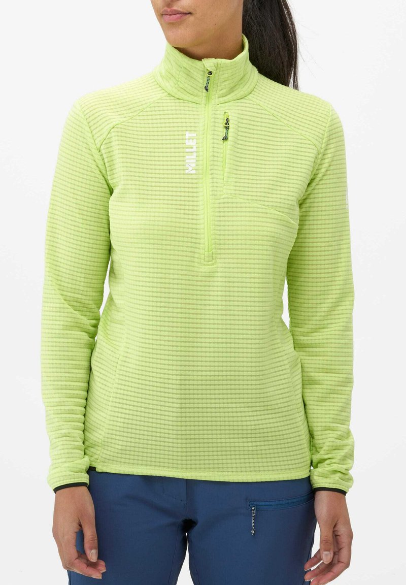 Haut en polaire vert clair à manches longues avec un col montant, fermeture éclair quart sur le devant, motif en grille texturé et logo sur la poitrine.
