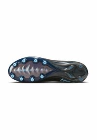 Suela de tacos de fútbol con picos negros y azules, que cuenta con una placa intermedia transparente y el logotipo "ZOOM" visible por debajo.