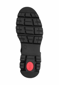 Sole in gomma nera con scanalature profonde per una migliore aderenza, con un accento circolare rosso e dimensione etichettata come 37. Superficie testurizzata per resistenza.