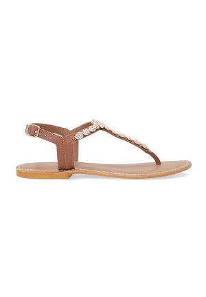 Brown flat sandals with a toe loop, embellished strap featuring clear stones, and adjustable ankle strap. Smooth leather upper with stitched edges.