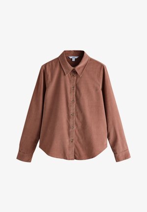 Camicia a maniche lunghe color ruggine realizzata in tessuto strutturato. Presenta un colletto appuntito e chiusura frontale con bottoni marroni.