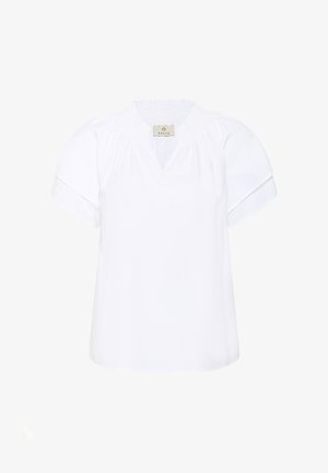 Weiße Bluse mit kurzen Ärmeln, gerafftem Ausschnitt und kleinem V-förmigen Schlitz, umgeschlagenen Manschetten und einem Etikett mit der Aufschrift "KAFFE" innen am Kragen.