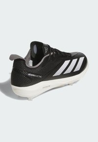 Black soccer cleat with a textured mesh upper, three white diagonal stripes, and a white outsole. Features a reinforced heel and lightweight design.