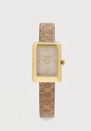 Reloj rectangular en tono dorado con correa de piel beige texturizada, esfera minimalista que muestra el nombre de la marca "Coach New York" y el logotipo "C" a las 6 en punto.
