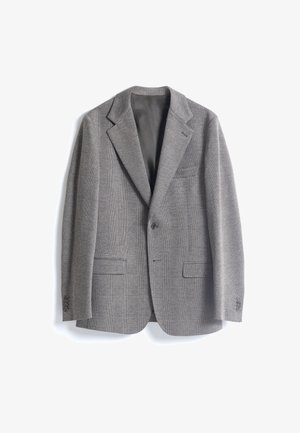 Blazer a cuadros grises con un diseño estructurado, solapas con muesca, cierre de dos botones y dos bolsillos frontales. Tejido suave y texturizado.