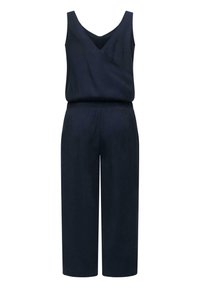 Marineblå jumpsuit med V-hals, uten ermer og elastisk midjebånd. Korte vide bukser med en glatt, strukturert stoff.