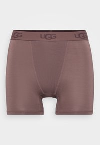 Smeđi UGG bokserice s glatkom teksturom, s kontrastnim pojasom na kojem se nalazi UGG logo. Dizajnirane su s udobnim srednjim krojem i bez otvora.