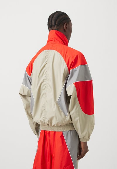 adidas by Stella McCartney TRACKTOP - Training jacket - desert sand/active red