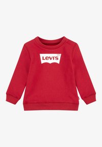 Felpa rossa in misto cotone. Caratterizzata da polsini e scollatura a costine, con il logo bianco di Levi's al centro e una vestibilità classica.