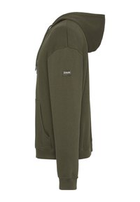 Felpa con cappuccio in verde oliva scuro. Realizzata in morbido tessuto testurizzato, presenta una tasca frontale, coulisse e un piccolo logo sulla manica.